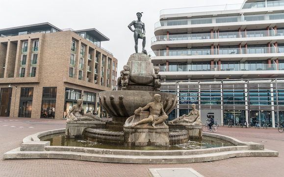 Leeuwarden, The Netherlands, april 14 2018, people passing by the Mercurius fountain