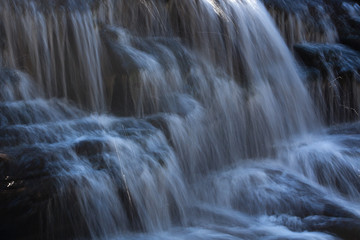 Fototapeta na wymiar Waterfall over rocks