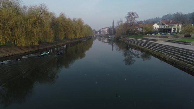 Two people kayaking on a river