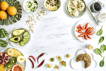 Photography of variuos bio fruits and vegetables on the marble table. Healthy food background with copy space for menu or slogan..