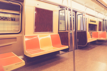 Vintage style New York City subway car interior with retro filter