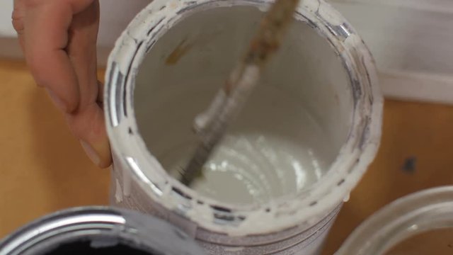 Mixing colors with a stirring stick
