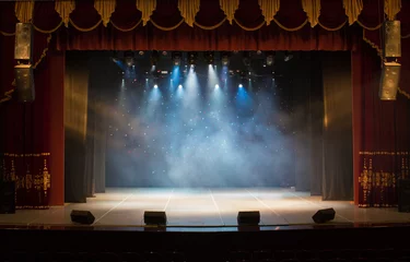 Foto op Plexiglas The stage of the theater illuminated by spotlights from the auditorium © Kozlik_mozlik
