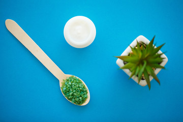 Green Bath Salt in Wooden Spoons Close-up