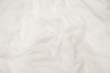 Close up of white bedding sheets soft focus and copy space