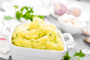 Mashed potato. Potato mash with garlic and parsley. Boiled potato. Potato puree