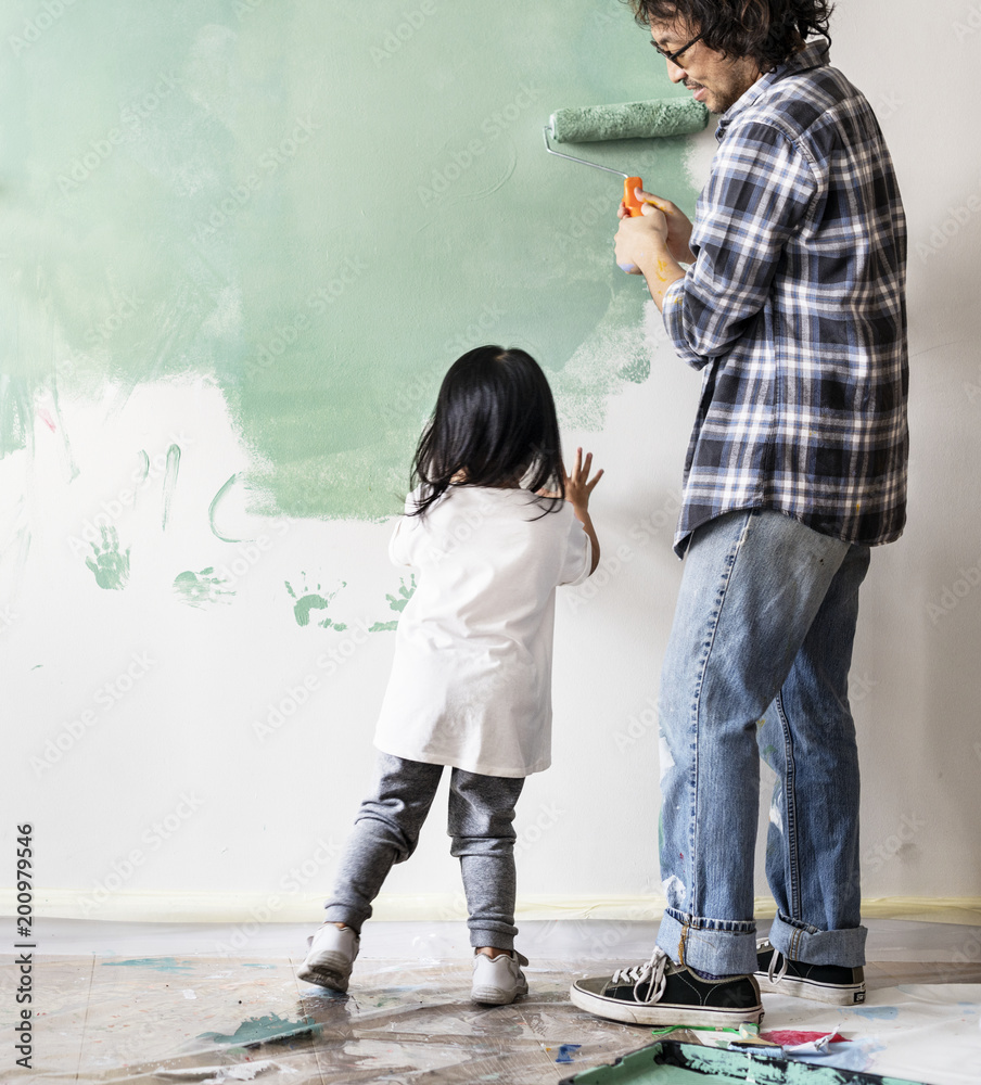 Wall mural Asian family renovating the house