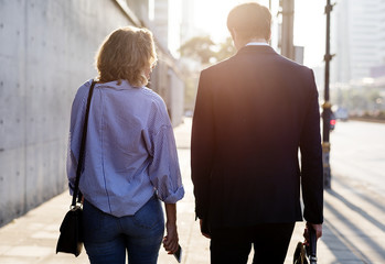 Couple walking on the pavement