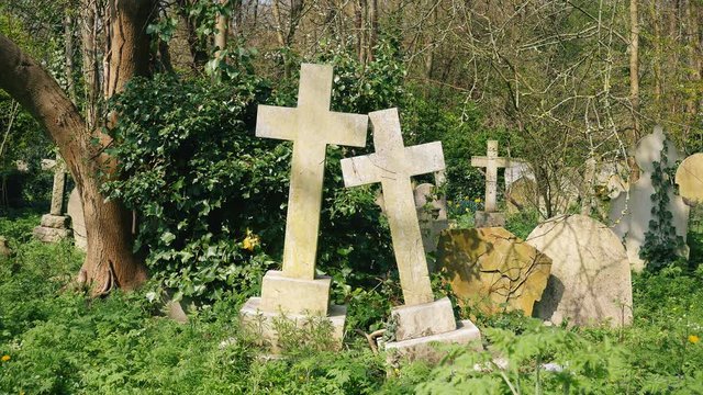 Two old stone crosses in the cemetery.