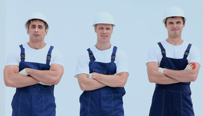 Fototapeta premium successful team builders in overalls and helmets