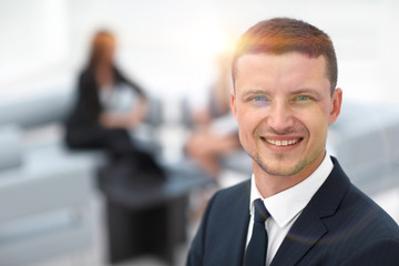 successful businessman on blurred background office