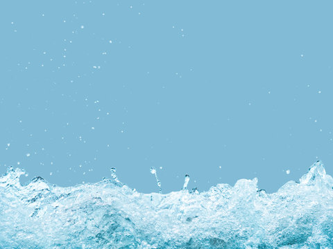 Splashing Water Of Sea Wave Isolated On Blue Background With Clipping Path