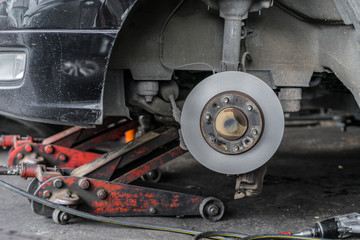 disc brake repair and wheel assembly at service station