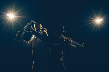 Musician Duo band playing the Trumpet with spot light and lens flare on the stage, musical concept