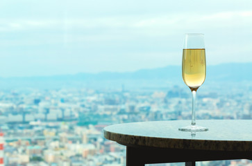 White wine on a table high above the city