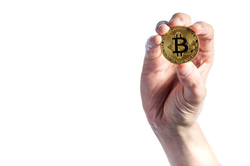 Bitcoin cryptocurrency coin held by a man on a white background