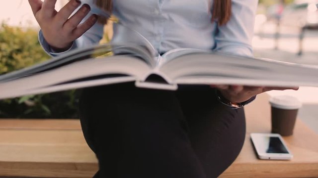 Young Business Woman Reading Book Outdoor