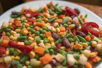 Frozen mexican mix of vegetables assorted on white plate