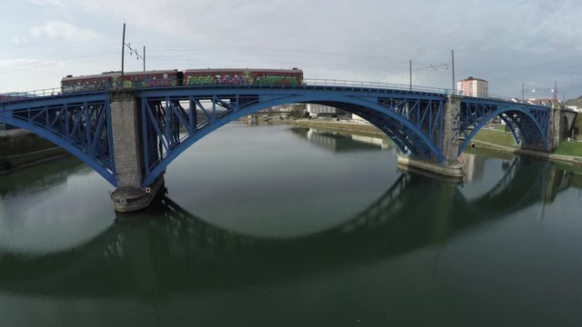 Aerial view of a train rolling on the Blue Brige, Maribor