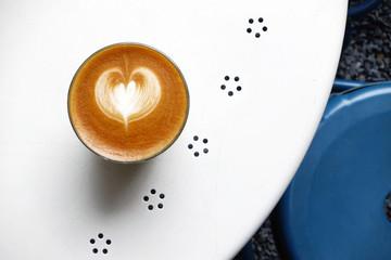 a cup of latte art coffee for background