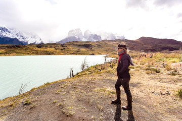 woman looking toward awesome view of Torres del Paine mountain range