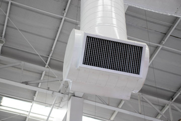 white air conditioner on the ceiling in the shopping mall.