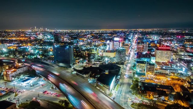 Cinematic aerial hyperlapse (timelapse in motion) of Hollywood area city view and 101 freeway traffic at night