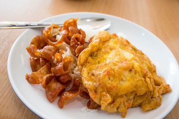 Chinese sausages and omelet topping on rice.
