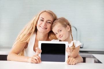 Female and child with a tablet