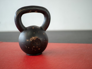 Fototapeta na wymiar 10 kg kettle bell sitting on gym mat