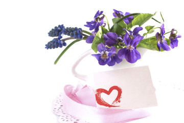 beautiful little bouquet of forest violets with a note