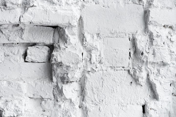 Closeup background of stylish damaged white brick wall