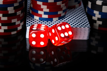 two red dice, a deck of cards and poker chips, on a black background with mappings