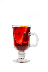 Monochrome transparent cocktail, red mulled wine in a high glass with a handle with spices and a slice of lemon, orange. Side view. Isolated white background. Drink for the menu restaurant, bar, cafe