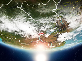 Rwanda with sun on planet Earth