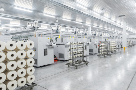 Machinery and equipment in the workshop for the production of thread, overview. interior of industrial textile factory
