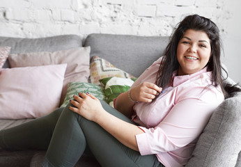People, happiness, fun, joy and body positivity concept. Picture of cheerful joyful young Caucasian...