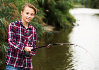 Teenage boy fishing