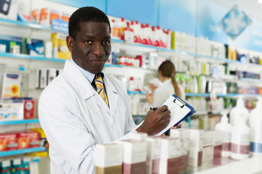 pharmacist taking inventory of medicines