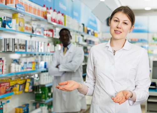 female pharmacist inviting to drugstore