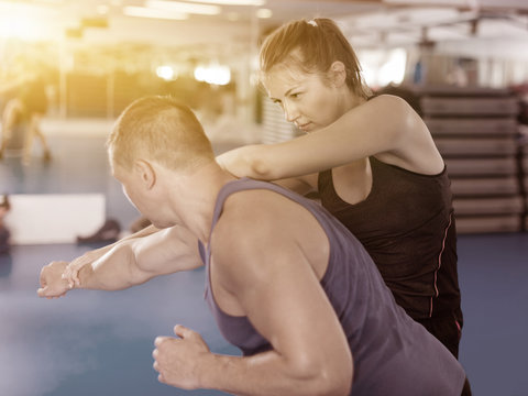 Nice female is fighting with trainer