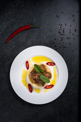 Delicious cooked couscous with meat on a white plate