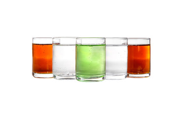 Multicolored transparent cocktails, a set of shots in a heap, a wedge, five servings. Side view Isolated white background. Drink for the menu restaurant, bar, cafe