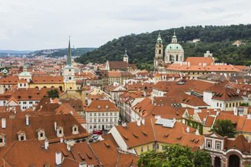 Fototapeta na wymiar View of the Old Town of Prague from a high point. Red roofs, historical architecture. Czech Republic