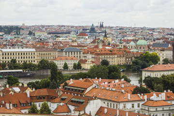 Naklejka na ściany i meble View of the Old Town of Prague from a high point. Red roofs, historical architecture. Czech Republic