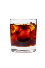 A single-colored transparent cocktail, refreshing in a low glass with radiant ice cubes with a taste of berries, cherries, strawberries, grapefruit, cola. Side view Isolated white background