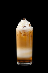 A multicolored, three-layered opaque cocktail in a tall glass with chopped ice, whipped cream and coffee beans, with a taste of coffee, caramel, cream and straw. Side view. Isolated black background