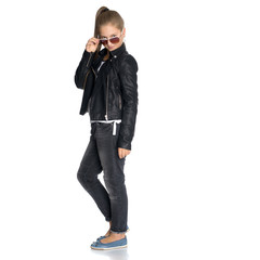 Fototapeta premium A teenage girl in a leather jacket and glasses