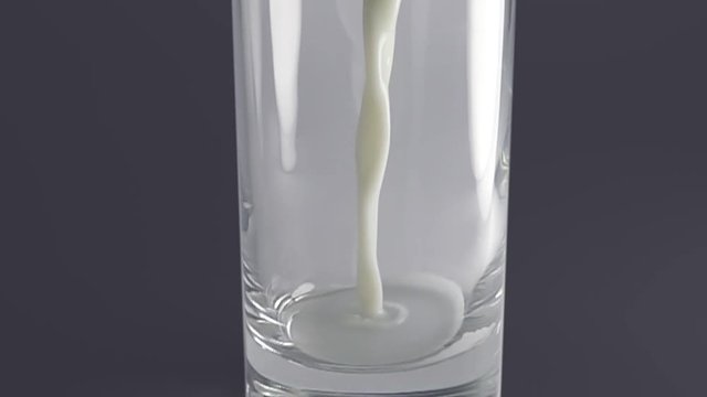 Milk pouring into glass in slow motion