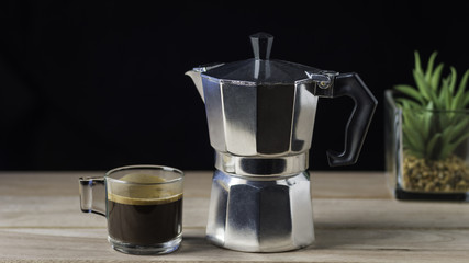 moka pot coffee cup isolated in dark background